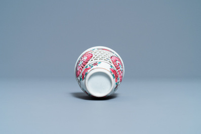 A Chinese reticulated double-walled famille rose cup and saucer, Yongzheng