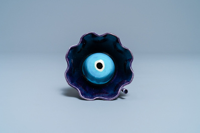 A Chinese aubergine- and turquoise-glazed 'lotus' trick cup, Kangxi