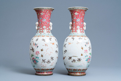 A pair of Chinese famille rose 'phoenix' vases, Tongzhi mark and of the period