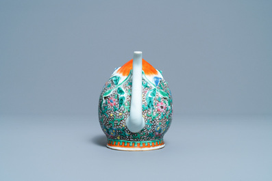 A Chinese famille rose peach-shaped 'cadogan' teapot with applied floral design, Qianlong