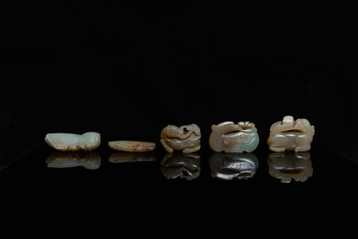 Five Chinese celadon and russet jade carvings, 19th C.