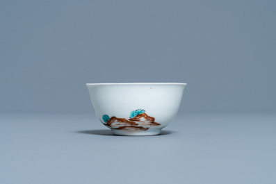 A Chinese export porcelain cup and saucer with a seamstress, Qianlong