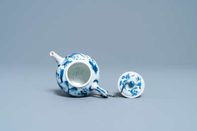 A Chinese blue and white tripod teapot with figures in a landscape, Kangxi