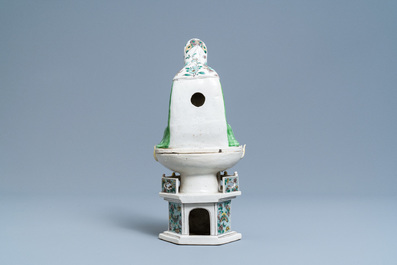 A Chinese verte biscuit group of Guanyin on a lotus throne, Kangxi