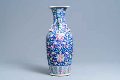 A Chinese famille rose blue-ground vase, 19th C.