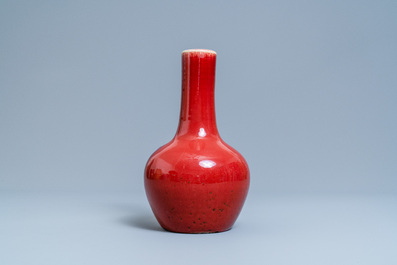 A Chinese monochrome sang de boeuf-glazed bottle vase, 19th C.