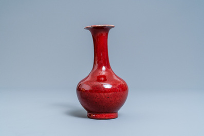 A Chinese monochrome sang de boeuf-glazed bottle vase, 19th C.