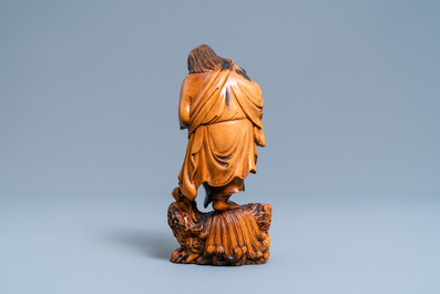 A Chinese carved boxwood figure of Liu Hai, Qing