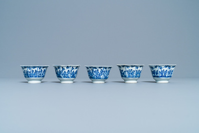 Five Chinese blue and white cups and saucers, Kangxi mark, 19th C.