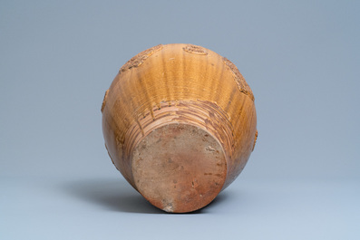 A Chinese brown-glazed relief-molded martaban jar with floral panels, Qing