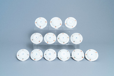 Eleven Chinese famille verte cups and thirteen saucers, Kangxi