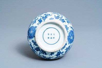 A Chinese blue and white lotus scroll vase, Xuande mark, Kangxi