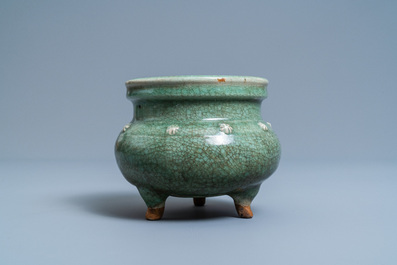 A Chinese monochrome celadon and crackle-glazed tripod censer, Ming