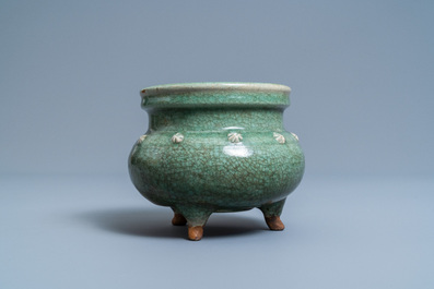 A Chinese monochrome celadon and crackle-glazed tripod censer, Ming