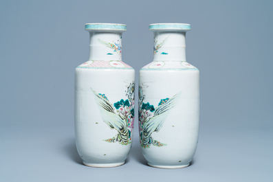 A pair of Chinese famille rose rouleau vases with immortals, 19/20th C.