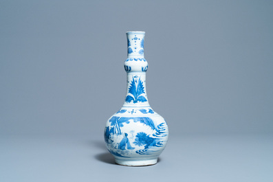 A Chinese blue and white bottle vase with figures in a landscape, Transitional period