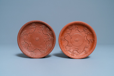 A pair of Chinese Yixing stoneware dishes with applied design, Kangxi
