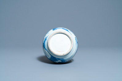 A Chinese blue and white bottle vase with figures in a landscape, Transitional period