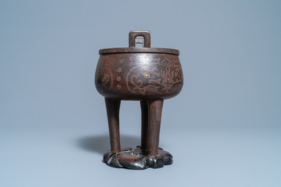 A Chinese inlaid bronze tripod censer on wooden stand, Ming