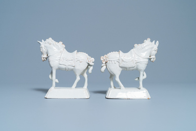 A pair of white Dutch Delftware models of horses, 18th C.