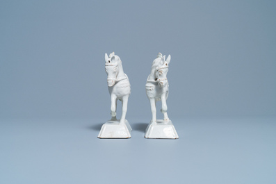 A pair of white Dutch Delftware models of horses, 18th C.