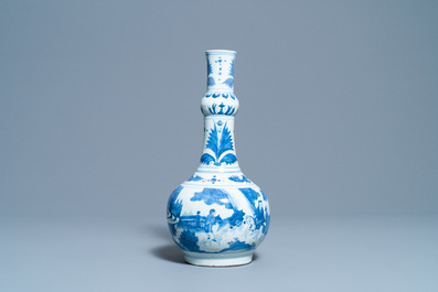 A Chinese blue and white bottle vase with figures in a landscape, Transitional period