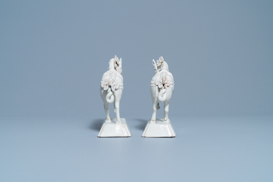 A pair of white Dutch Delftware models of horses, 18th C.