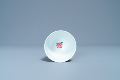 A Chinese famille rose cup and saucer with a bird on a blossoming branch, Yongzheng