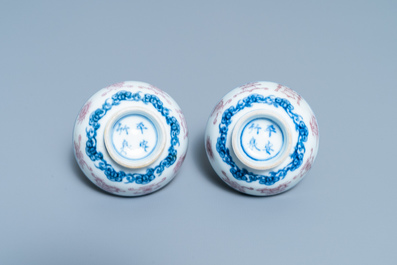 A pair of Chinese blue, white and copper red 'bajixiang' tea bowls, 4-character mark, 19/20th C.