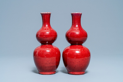 A pair of Chinese sang de boeuf-glazed double gourd vases, 19th C.