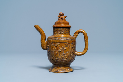 A Chinese brown-glazed relief-decorated teapot and cover, 18/19th