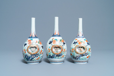 Three Japanese Imari bottle vases with molded panels, Edo, 17/18th C.