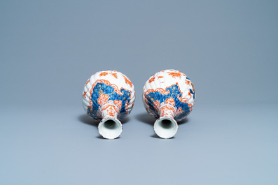 A pair of ribbed Dutch Delft dor&eacute; vases, 18th C.