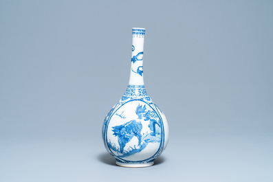 A Chinese blue and white 'qilin' bottle vase, 19th C.
