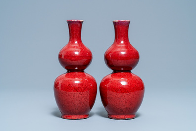 A pair of Chinese sang de boeuf-glazed double gourd vases, 19th C.