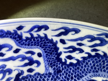 A Chinese blue and white 'dragon' dish, Kangxi mark and of the period