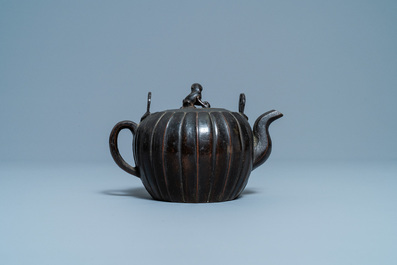 A Chinese lacquered bronze teapot and cover, Yuan