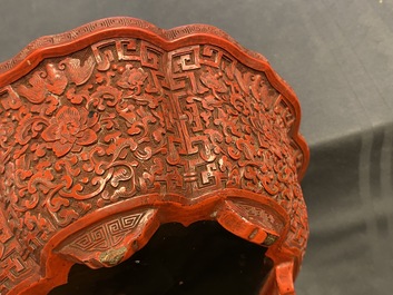 A Chinese carved cinnabar lacquer jardini&egrave;re, Yongzheng/Qianlong