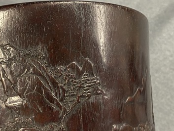 A Chinese carved zitan wood brush pot with a mountainous landscape, 17/18th C.