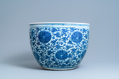 An exceptionally large Chinese blue and white 'lotus scroll' fish bowl, Kangxi