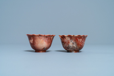 A pair of Chinese Shoushan soapstone gilt-decorated engraved cups and saucers, Kangxi