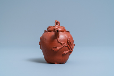 A Chinese Yixing stoneware lotus-shaped teapot and cover, Kangxi