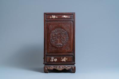 A Chinese mother-of-pearl-inlaid wooden two-door cabinet, 19th C.