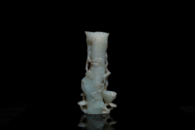 A Chinese jade vase on reticulated stand, Qing