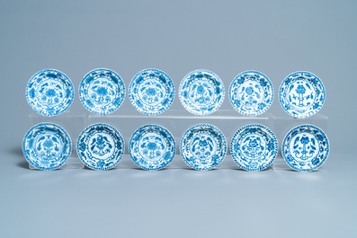 Seventeen Chinese blue and white cups and twenty-two saucers with floral design, Kangxi