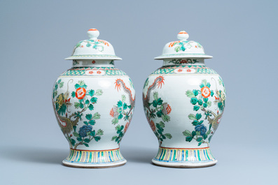 A pair of Chinese famille verte 'dragon' vases and covers, 19th C.