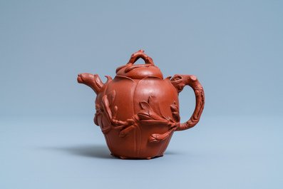 A Chinese Yixing stoneware lotus-shaped teapot and cover, Kangxi