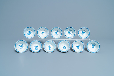 Eleven Chinese blue and white lobed cups and saucers, Kangxi