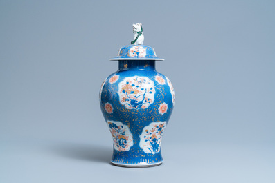 A Chinese blue, white, iron red and gilt powder blue-ground vase and cover, Kangxi