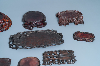 Nine Chinese naturalistically carved wooden stands, 19/20th C.